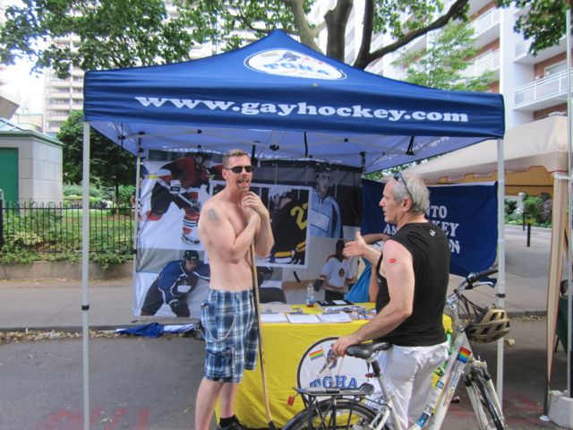Talking to potential new player at the Toronto Gay Hockey Association booth