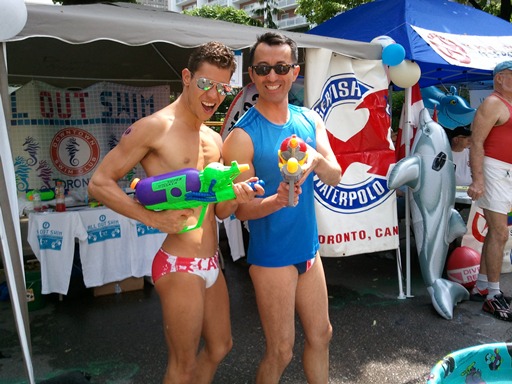 Downtown Swim Club swimmers show off thier swim wear and water guns in the SportZone